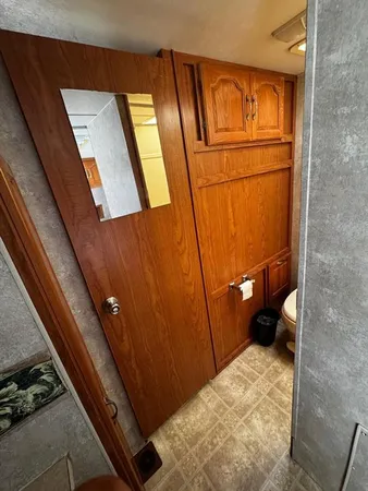 a bathroom with a sink a mirror and vanity