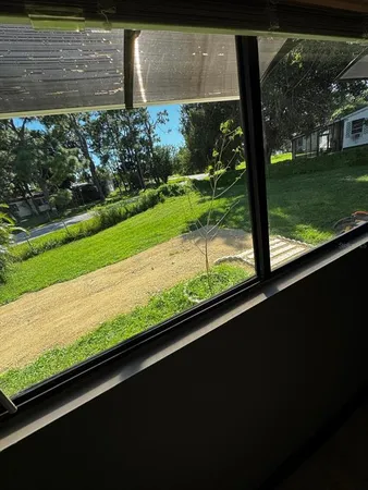 a view of a yard with an outdoor space