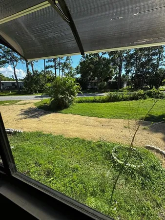 a view of a car in front of a house