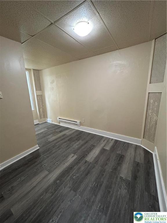 201 Main Street, Unit 2 Slatington, PA 18080 - Photo 8 of 9 an empty room with wooden floor and windows