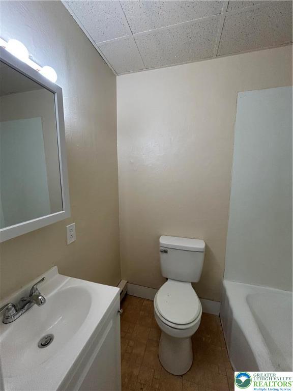 201 Main Street, Unit 2 Slatington, PA 18080 - Photo 9 of 9 a bathroom with a toilet sink and mirror