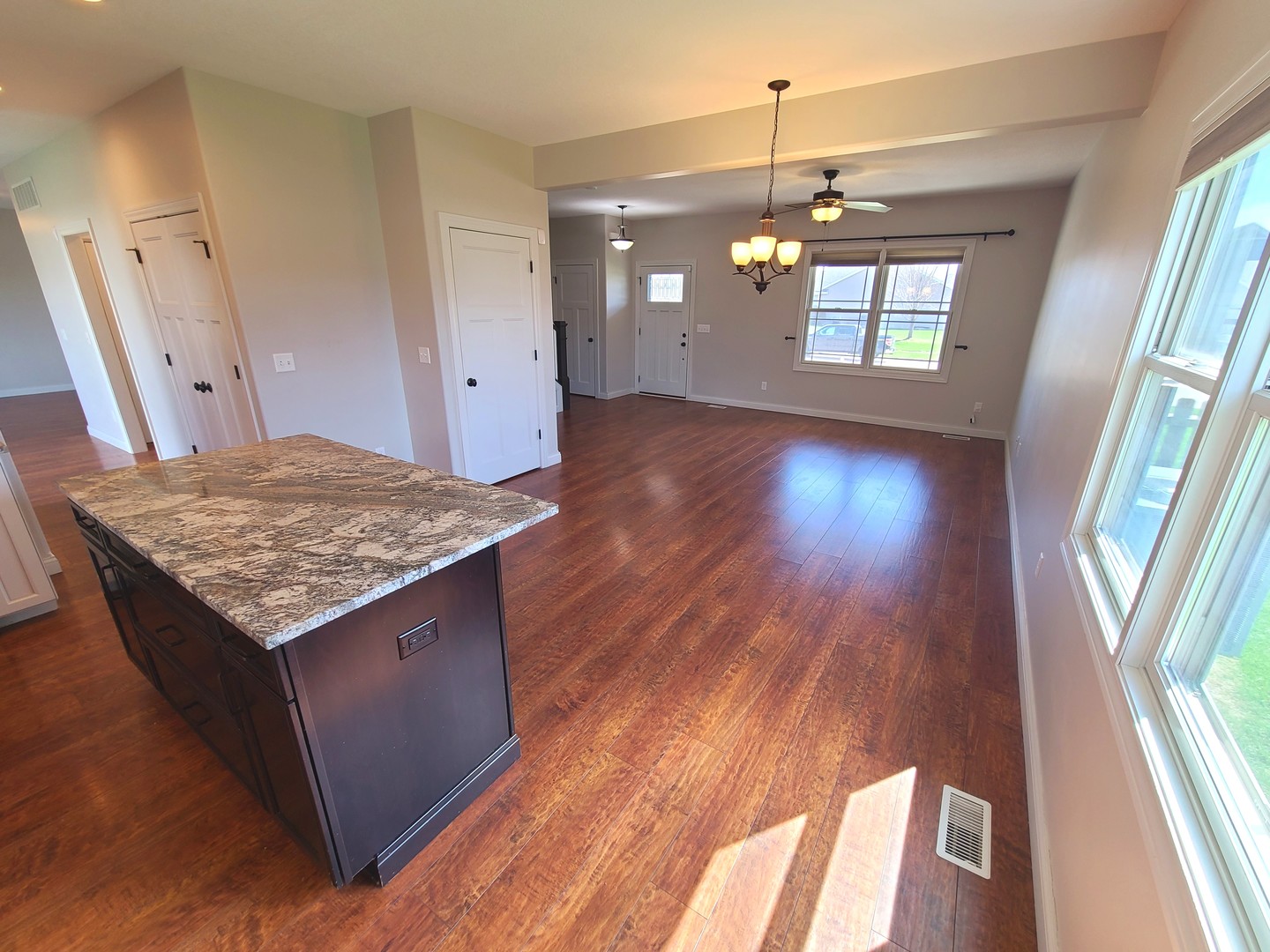 790 Muirfield Circle Eldridge, IA 52748 - Photo 11 of 36 wooden floor in an empty room with a window