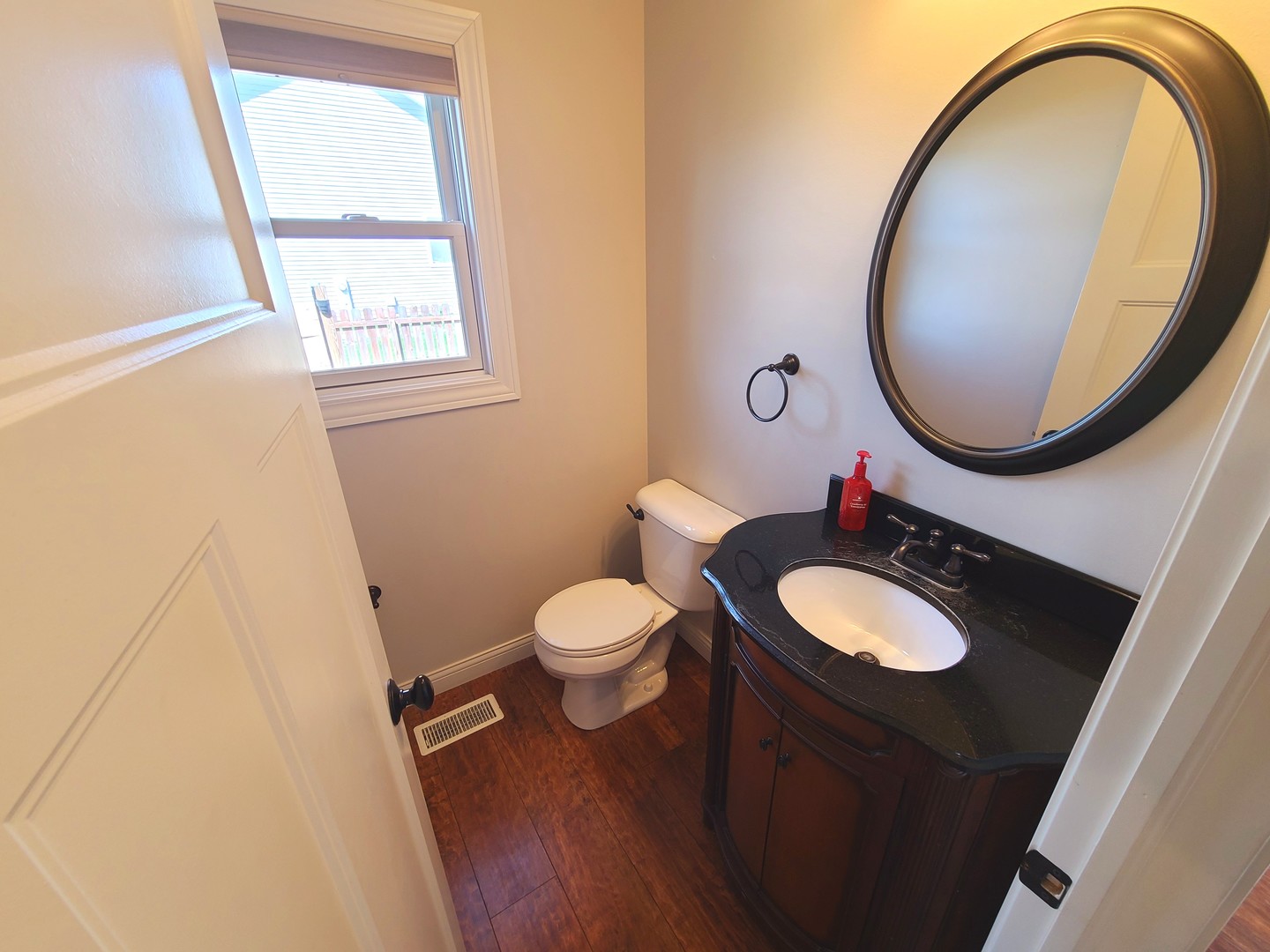 790 Muirfield Circle Eldridge, IA 52748 - Photo 14 of 36 a bathroom with a toilet a sink and a mirror