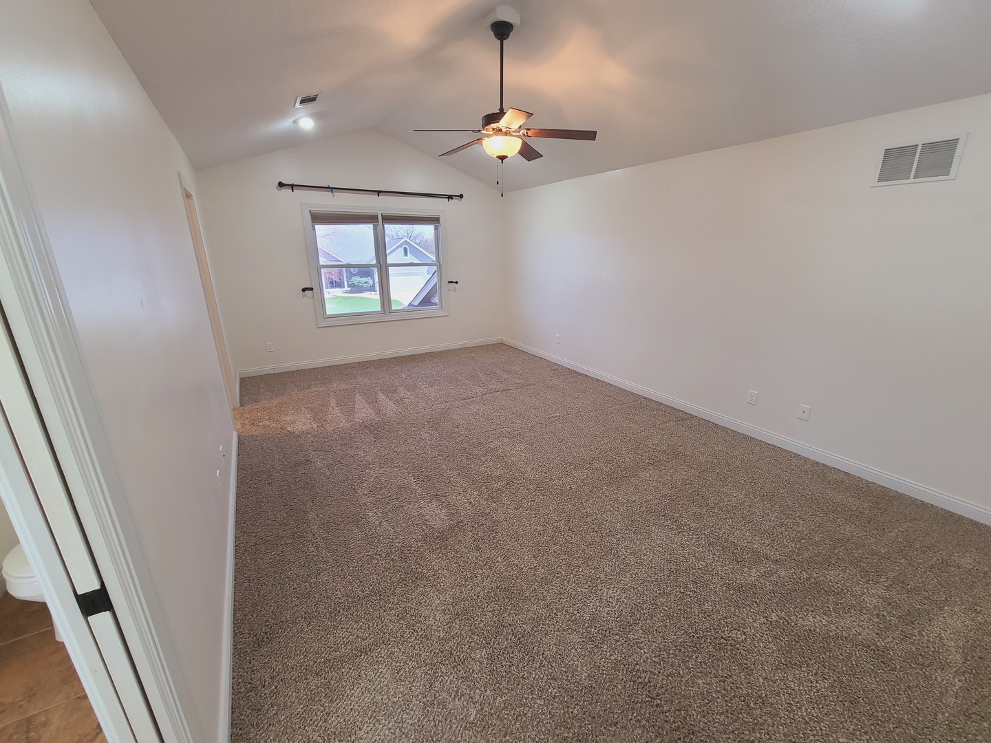 790 Muirfield Circle Eldridge, IA 52748 - Photo 16 of 36 wooden floor in an empty room with a window