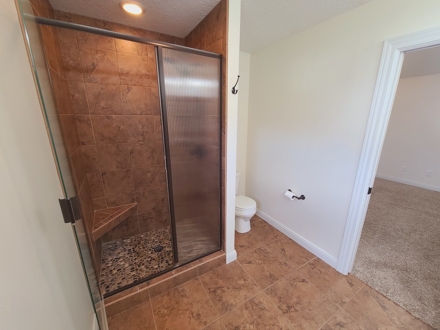790 Muirfield Circle Eldridge, IA 52748 - Photo 20 of 36 a bathroom with a shower and toilet