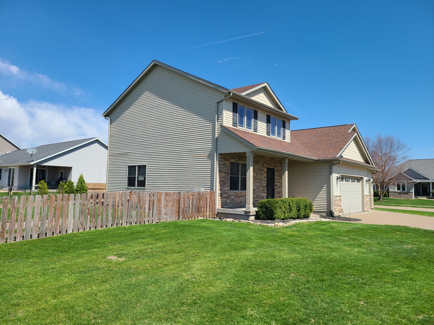 790 Muirfield Circle Eldridge, IA 52748 - Photo 2 of 36 a front view of a house with a yard