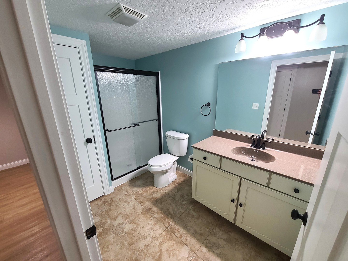 790 Muirfield Circle Eldridge, IA 52748 - Photo 33 of 36 a bathroom with a sink a toilet a mirror and shower
