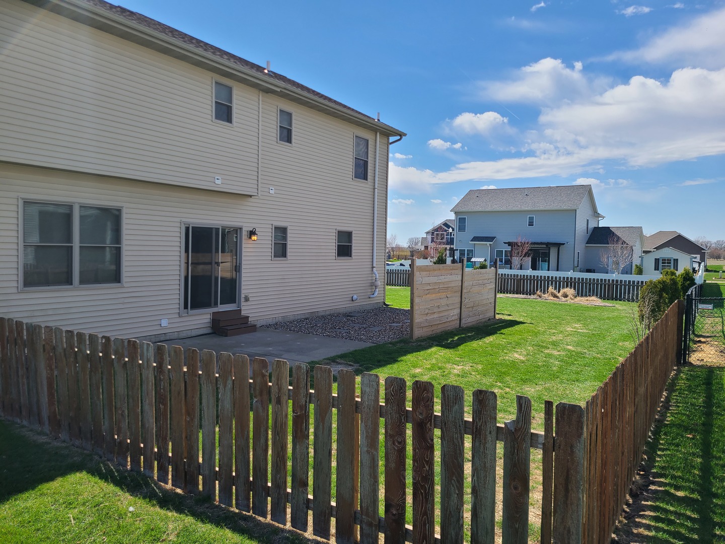 790 Muirfield Circle Eldridge, IA 52748 - Photo 5 of 36 a view of a porch with wooden fence