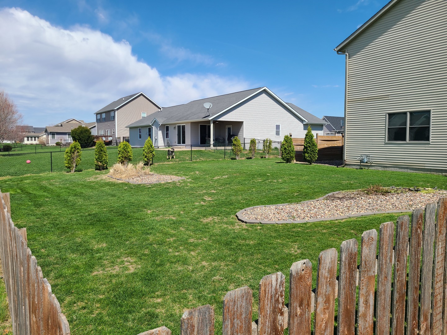790 Muirfield Circle Eldridge, IA 52748 - Photo 6 of 36 a front view of a house with a yard and porch