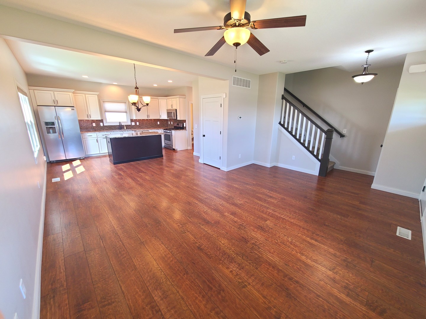 790 Muirfield Circle Eldridge, IA 52748 - Photo 7 of 36 a view of kitchen and hall with wooden floor