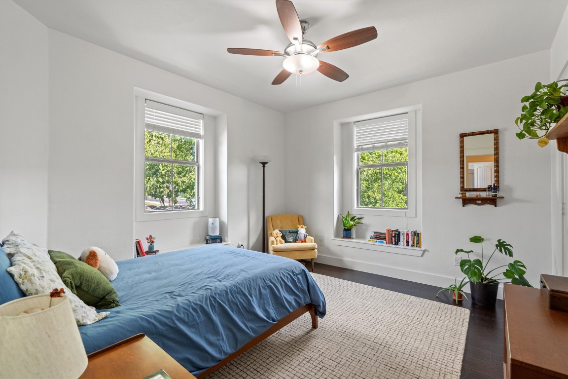 500 West 55th 1/2 Street, Unit A AND B Austin, TX 78751 - Photo 11 of 32 a bedroom with a bed ceiling fan and a window
