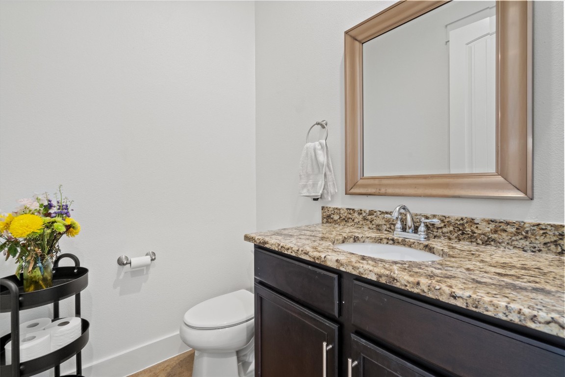 500 West 55th 1/2 Street, Unit A AND B Austin, TX 78751 - Photo 10 of 32 a bathroom with a granite countertop sink and a mirror