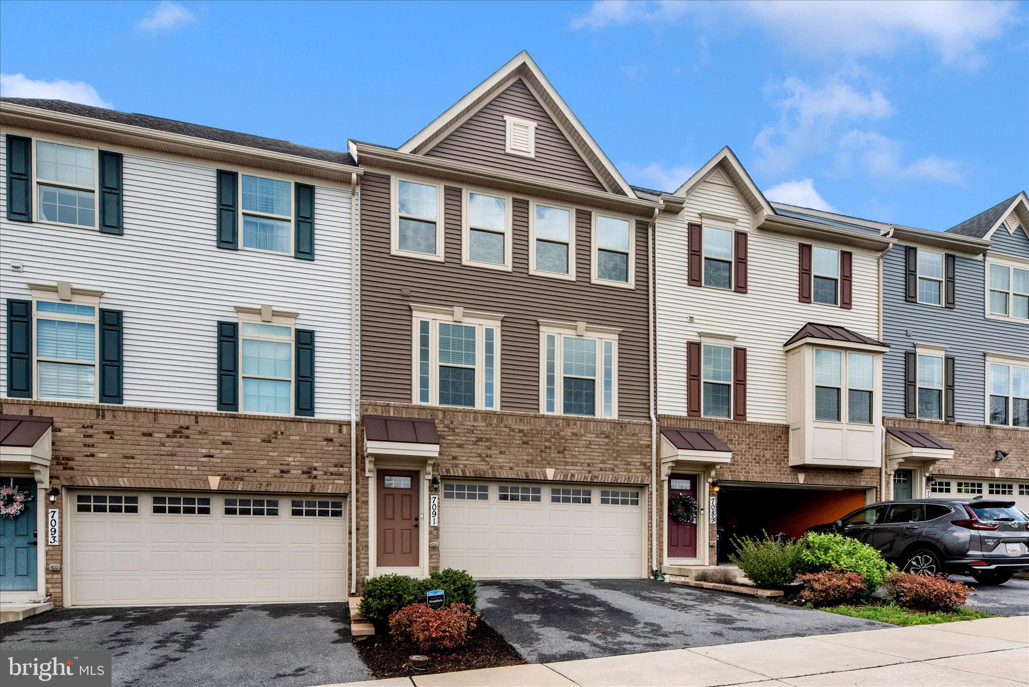 7091 Kokanee Way New Market, MD 21774 - Photo 49 of 69 a front view of a house with a yard and a garage