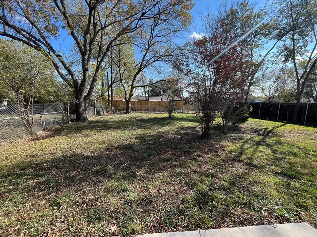 a view of a backyard of the house