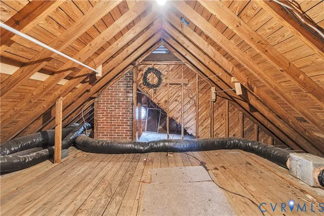 a view of house with backyard and seating area