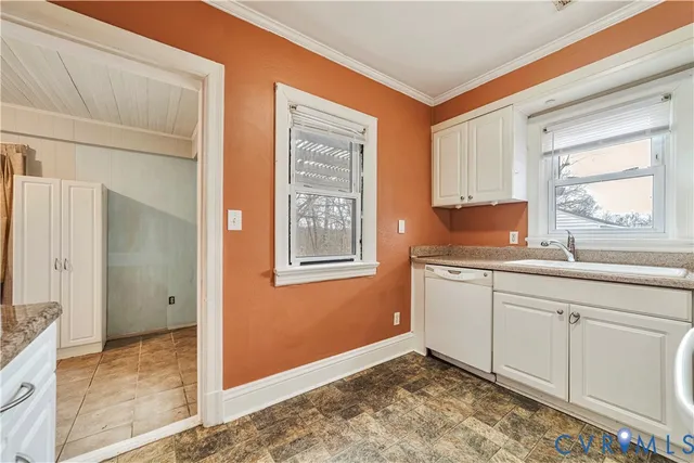 a view of empty room with fireplace and wooden floor