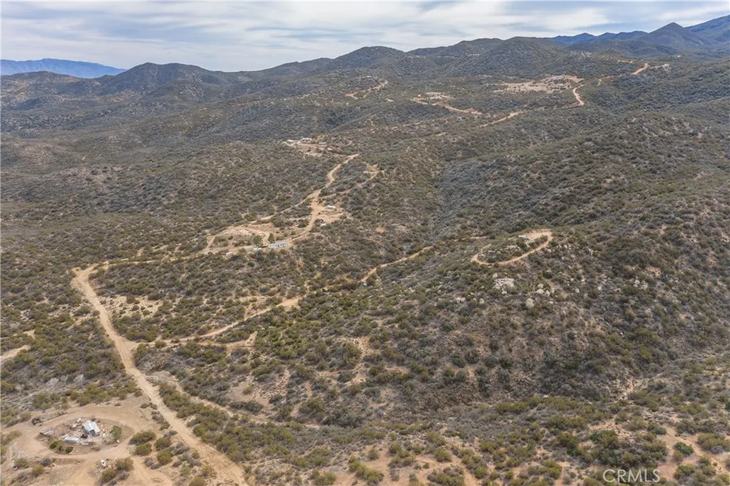 69 Rim Rock Road Anza, CA 92539 - Photo 11 of 14 a view of a mountain range with trees in the background