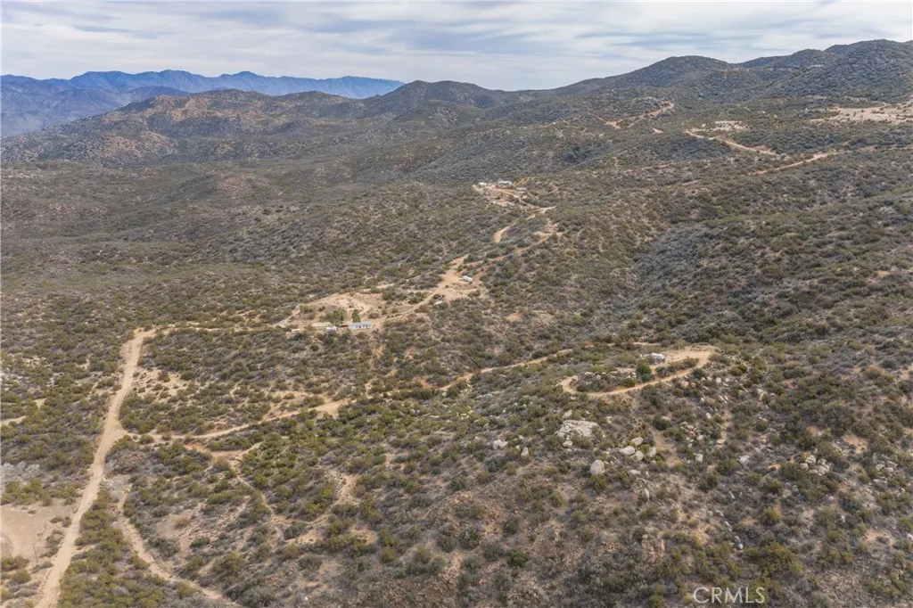 69 Rim Rock Road Anza, CA 92539 - Photo 5 of 14 a view of a mountain range with lush green forest
