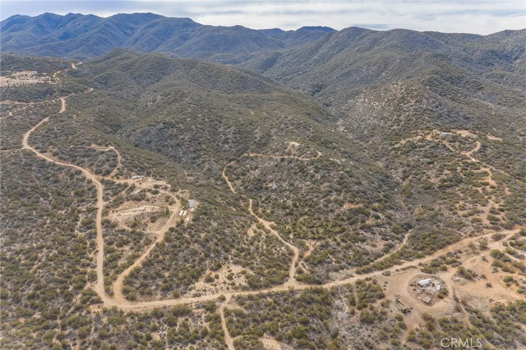 69 Rim Rock Road Anza, CA 92539 - Photo 7 of 14 a view of a dry field with mountains in the background