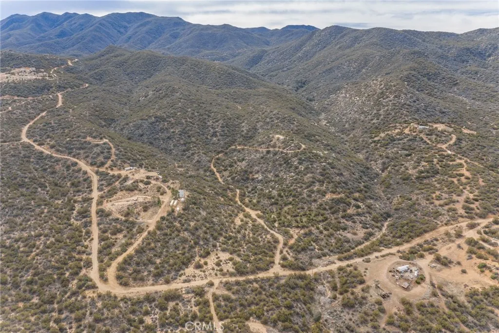 69 Rim Rock Road Anza, CA 92539 - Photo 7 of 14 a view of a dry field with mountains in the background