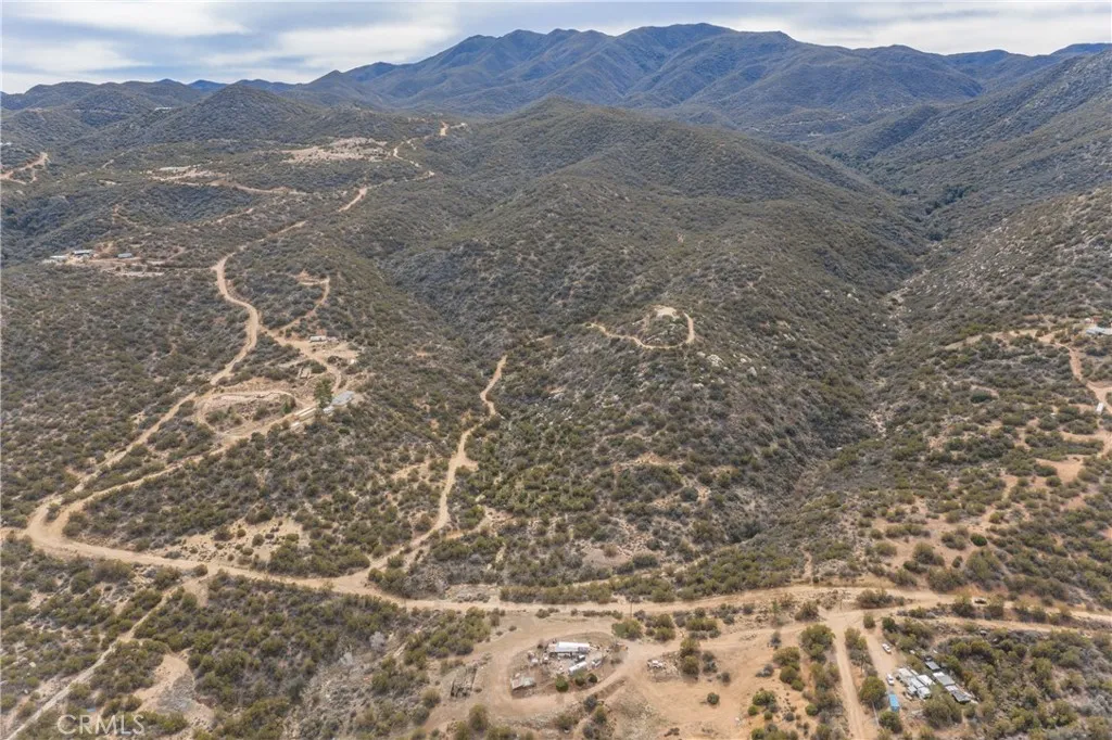 69 Rim Rock Road Anza, CA 92539 - Photo 8 of 14 a view of a dry field with mountains in the background