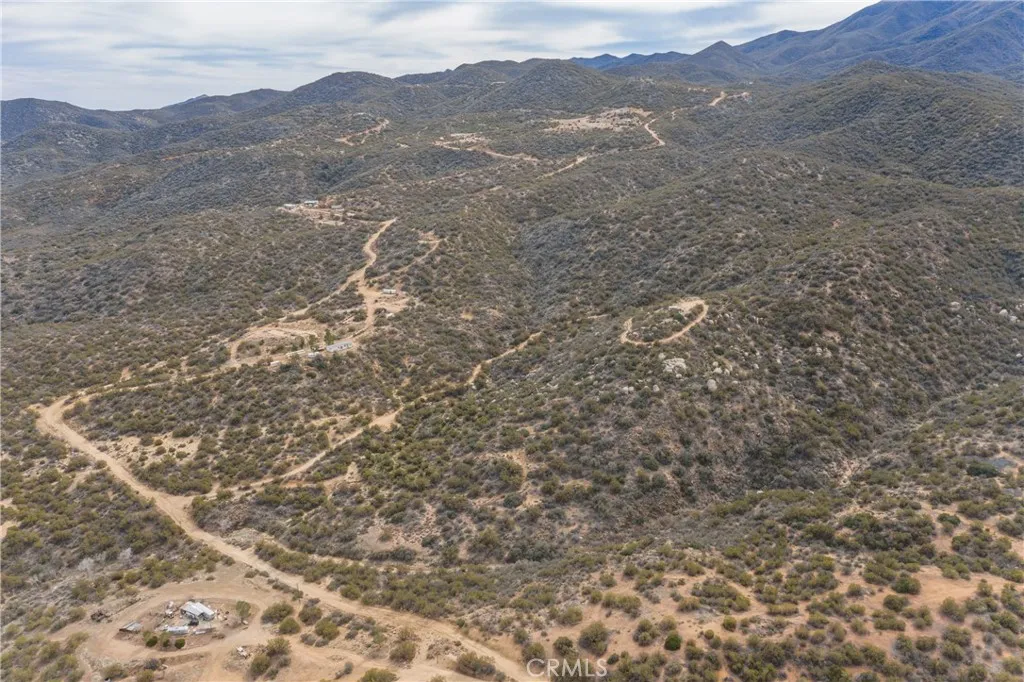 69 Rim Rock Road Anza, CA 92539 - Photo 9 of 14 a view of a mountain range with trees in the background