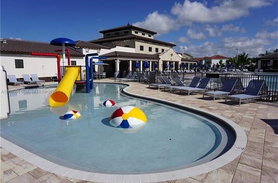 17154 Southwest 93rd Street, Unit STUDIO Miami, FL 33196 - Photo 8 of 9 a view of a swimming pool with a patio
