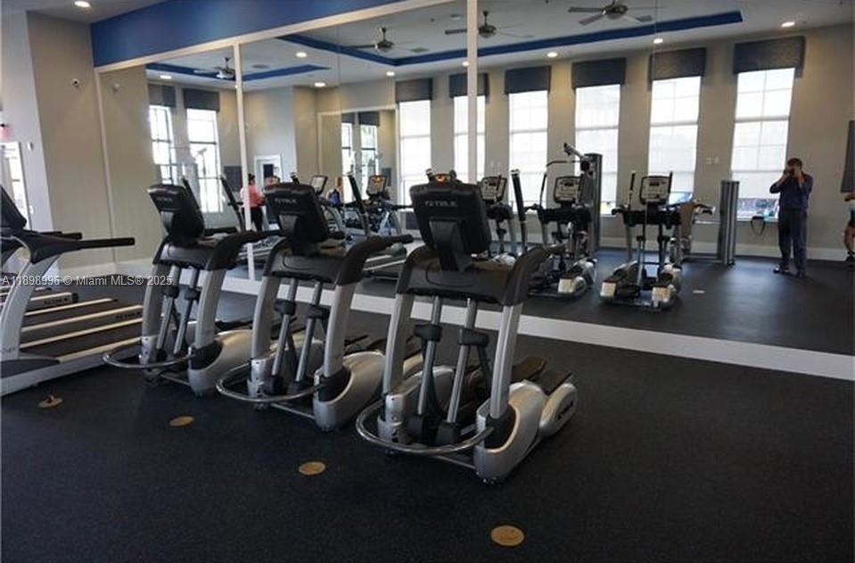 17154 Southwest 93rd Street, Unit STUDIO Miami, FL 33196 - Photo 9 of 9 a view of a room with gym equipment