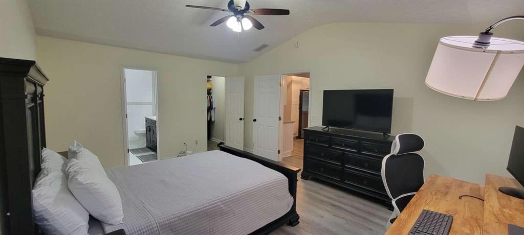 2140 Summerset Drive Monroe, GA 30656 - Photo 14 of 43 a bedroom with a bed and a flat screen tv