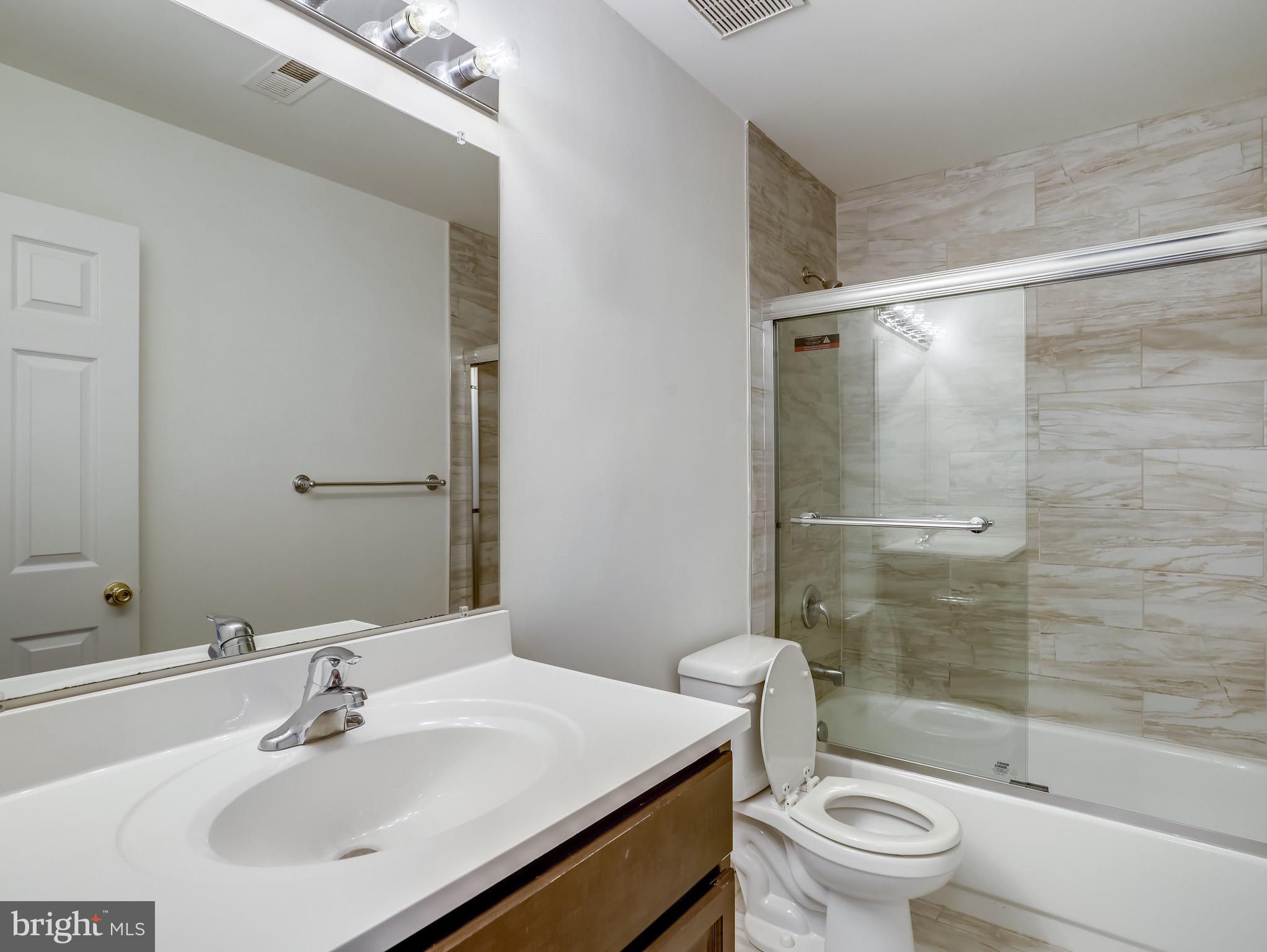 8739 Spring Brook Way Odenton, MD 21113 - Photo 18 of 53 Updated hall bathroom on 2nd floor.