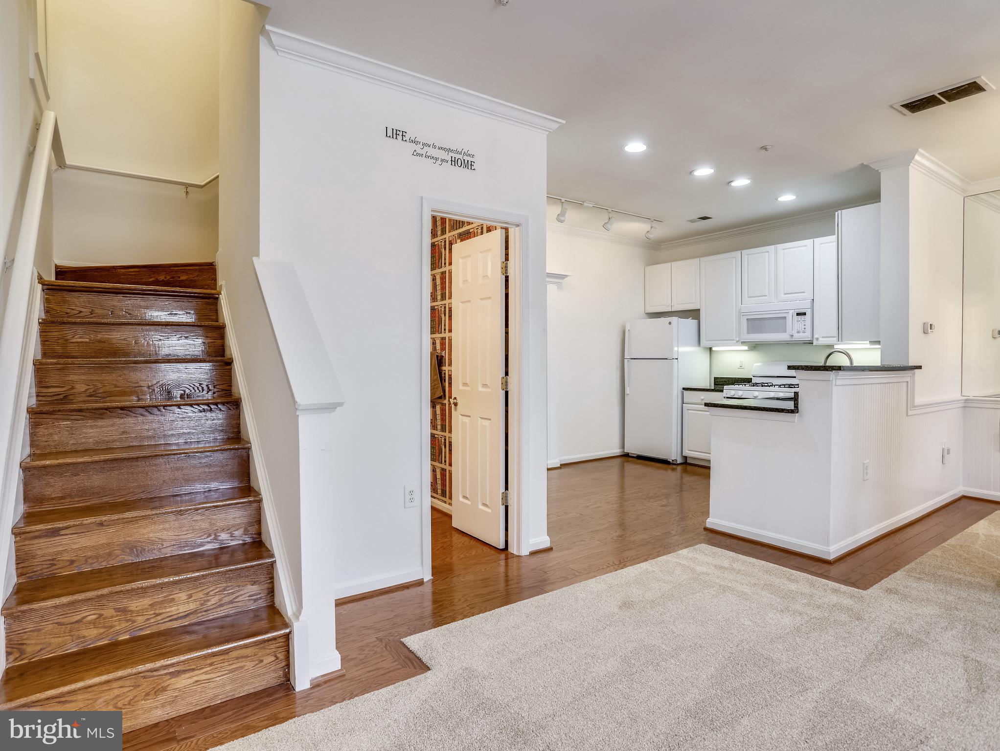 8739 Spring Brook Way Odenton, MD 21113 - Photo 2 of 53 Hardwood stairs and hardwood flooring.