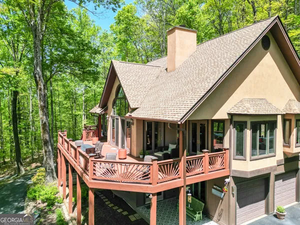 a kitchen with stainless steel appliances granite countertop a sink a stove and a wooden floors