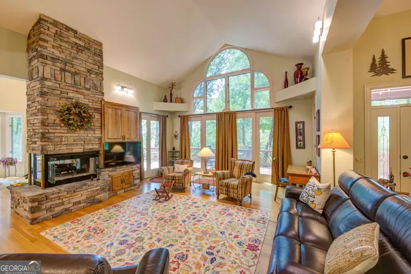 a bathroom with a shower sink and mirror