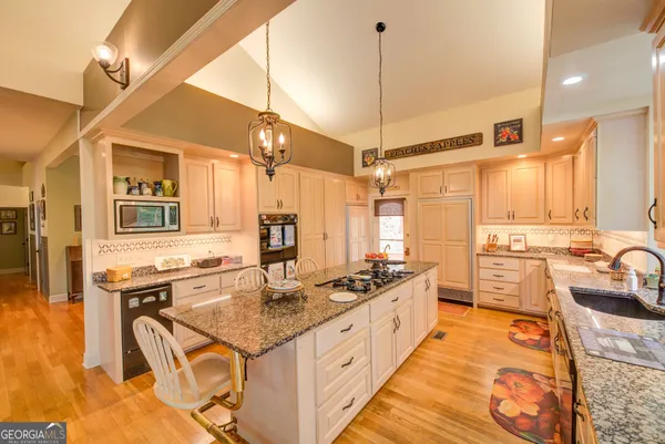 a bedroom with bed and a chandelier