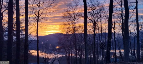 a view of house with a chairs and table in a patio