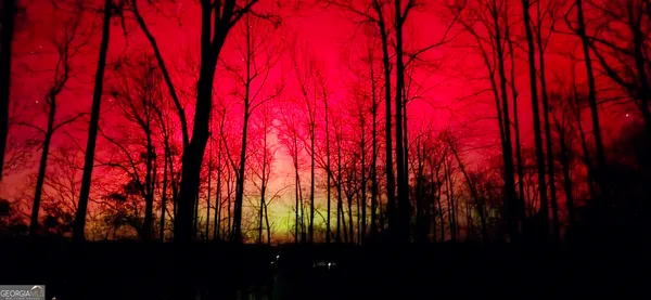 a living room with furniture tv and a fireplace