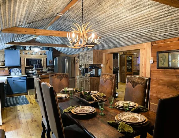 a kitchen with a refrigerator and a stove