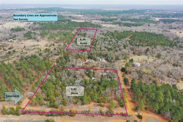 an aerial view of a residential houses with outdoor space