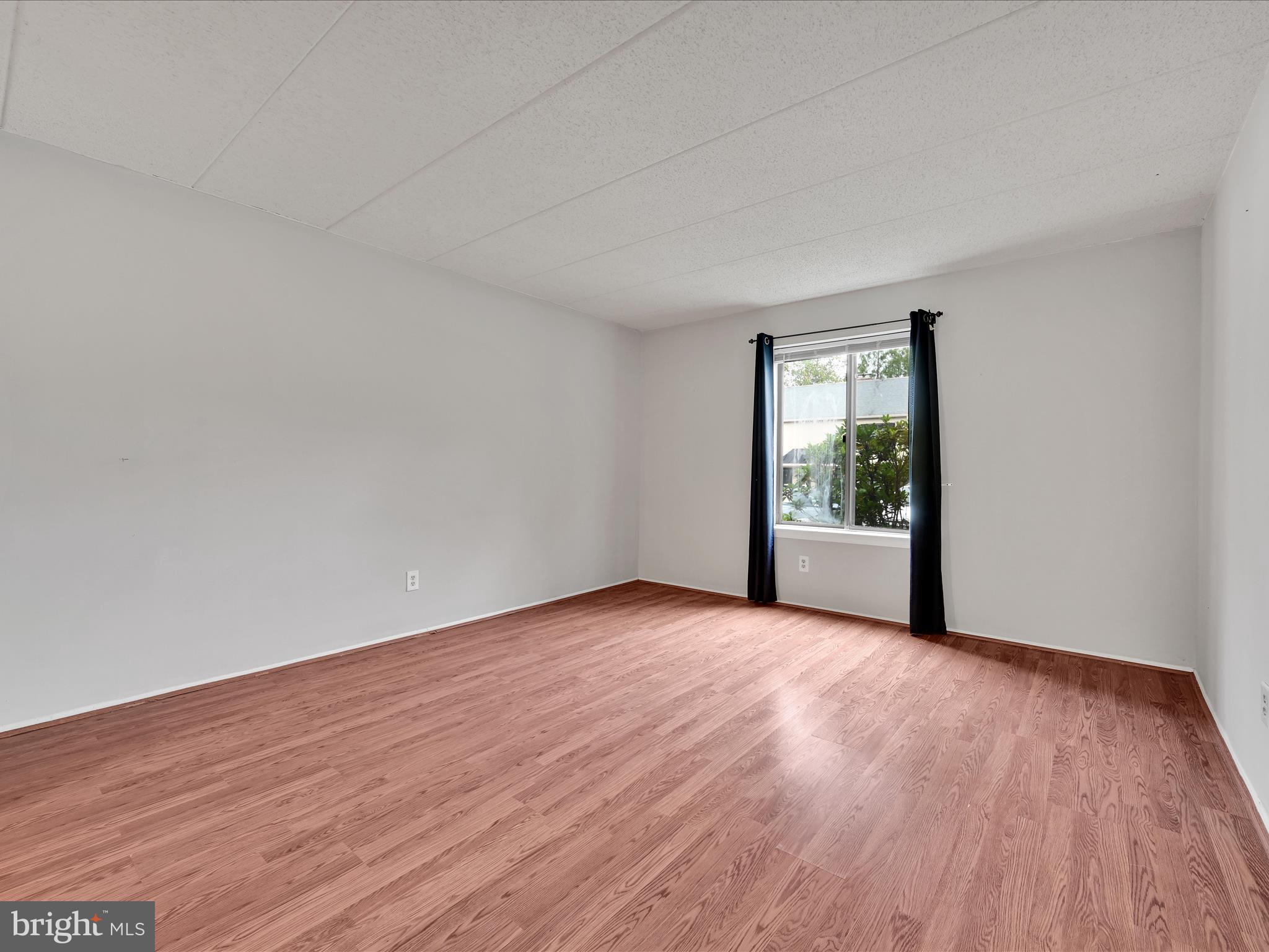 411 Conestoga Road, Unit 33 Devon, PA 19333 - Photo 11 of 23 a view of an empty room and wooden floor