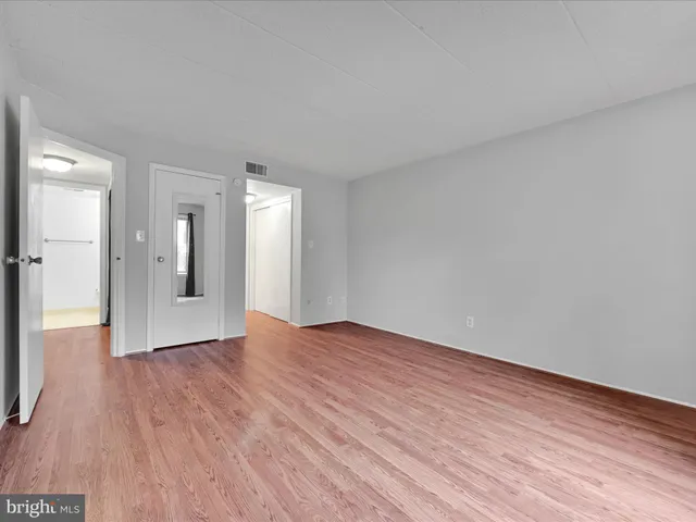 a view of an empty room and glass door