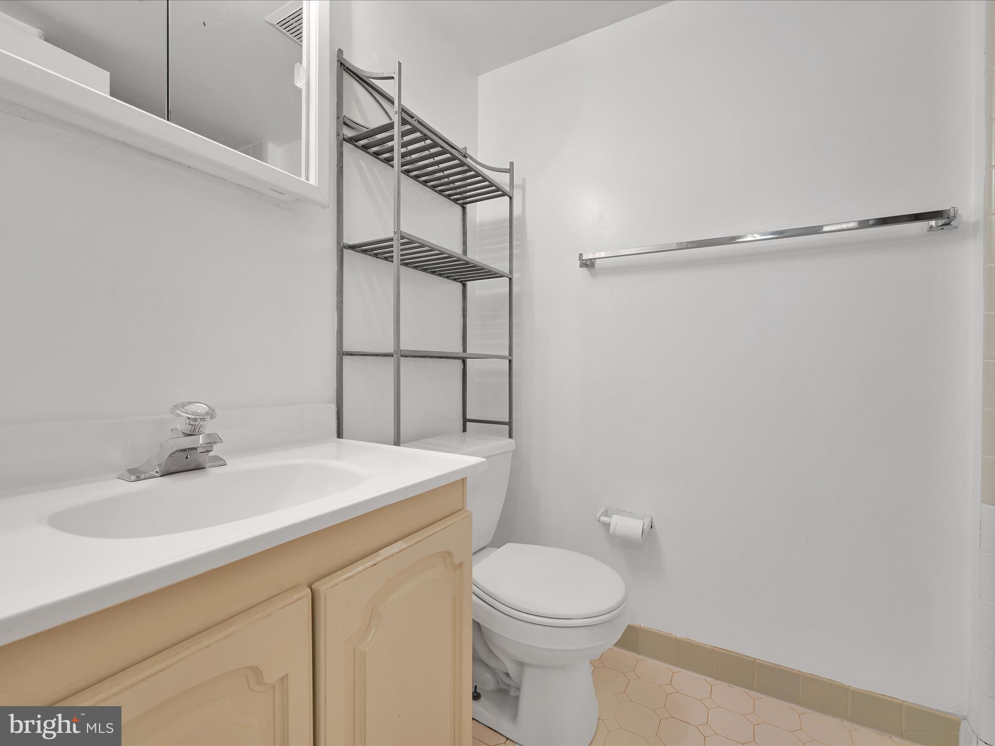 411 Conestoga Road, Unit 33 Devon, PA 19333 - Photo 14 of 23 a bathroom with a sink a toilet and shower