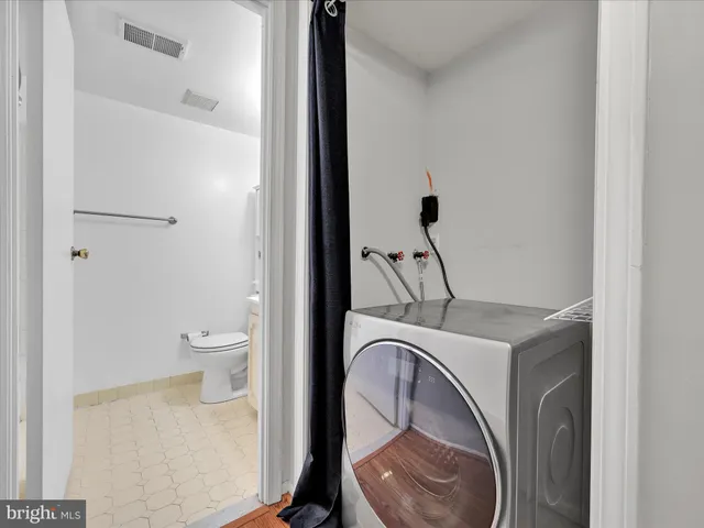 a bathroom with a toilet and a sink