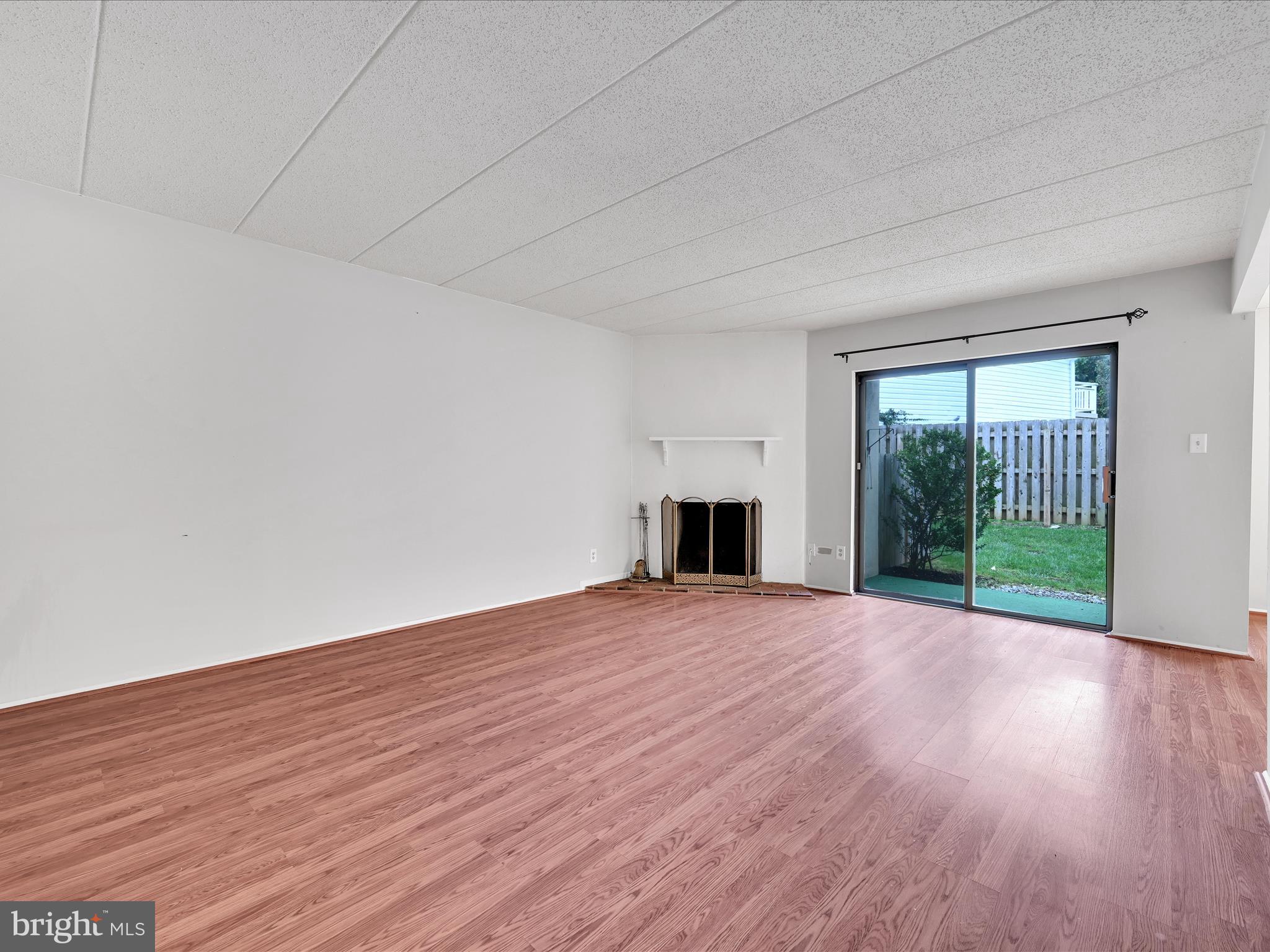 411 Conestoga Road, Unit 33 Devon, PA 19333 - Photo 4 of 23 a view of an empty room with wooden floor and a window
