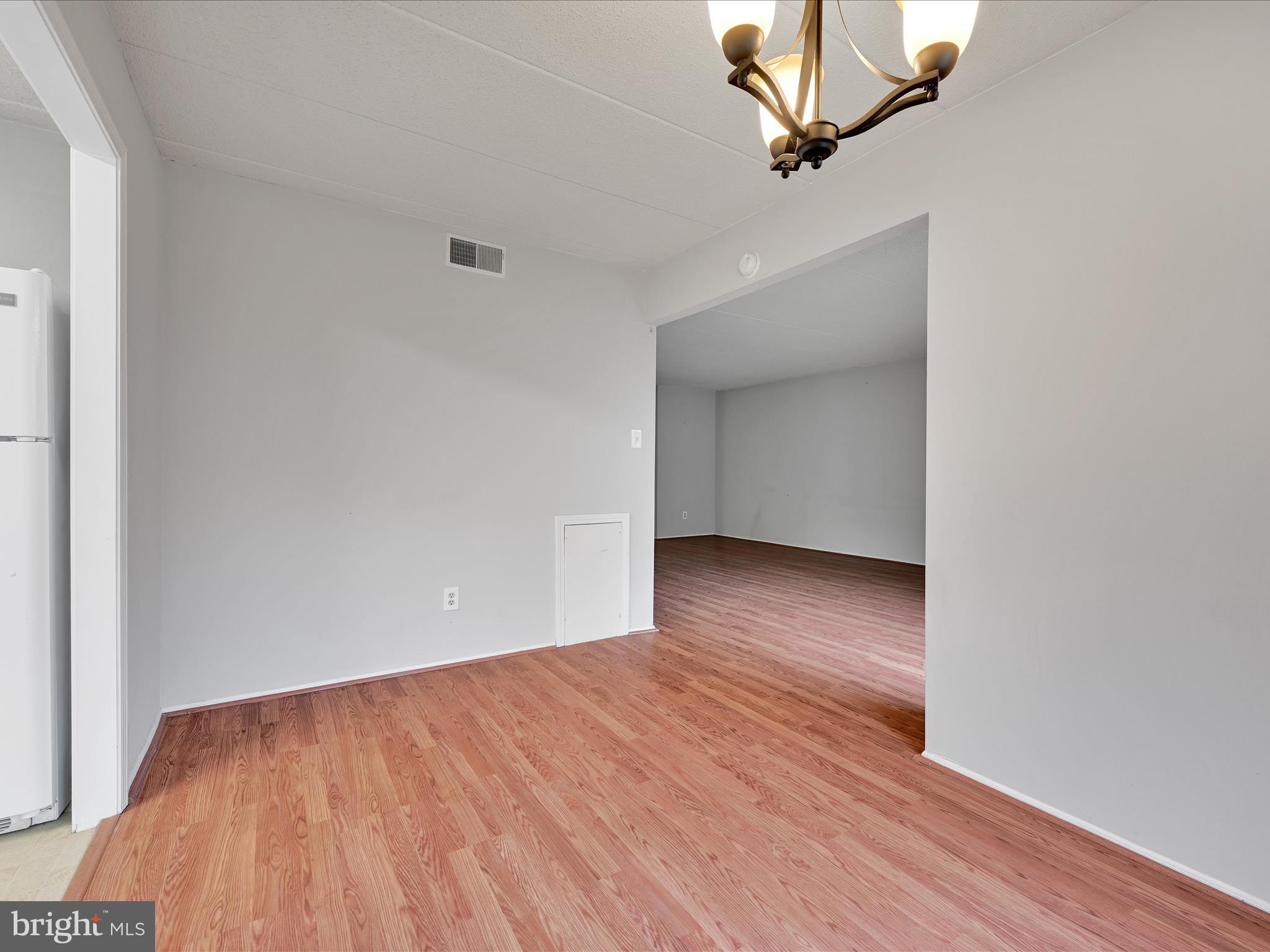 411 Conestoga Road, Unit 33 Devon, PA 19333 - Photo 7 of 23 wooden floor in an empty room