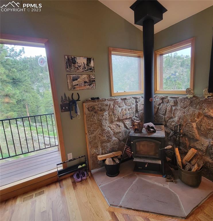 33348 Persistence Avenue Pine, CO 80470 - Photo 12 of 39 a living room with furniture and a floor to ceiling window