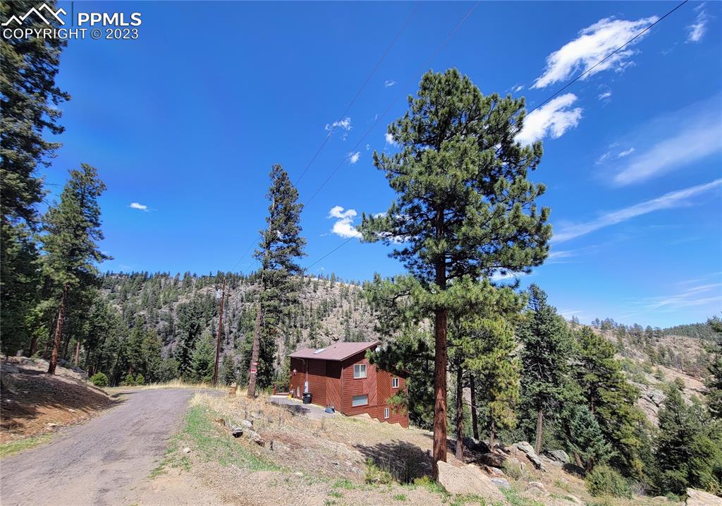 33348 Persistence Avenue Pine, CO 80470 - Photo 4 of 39 a view of a backyard with sitting area