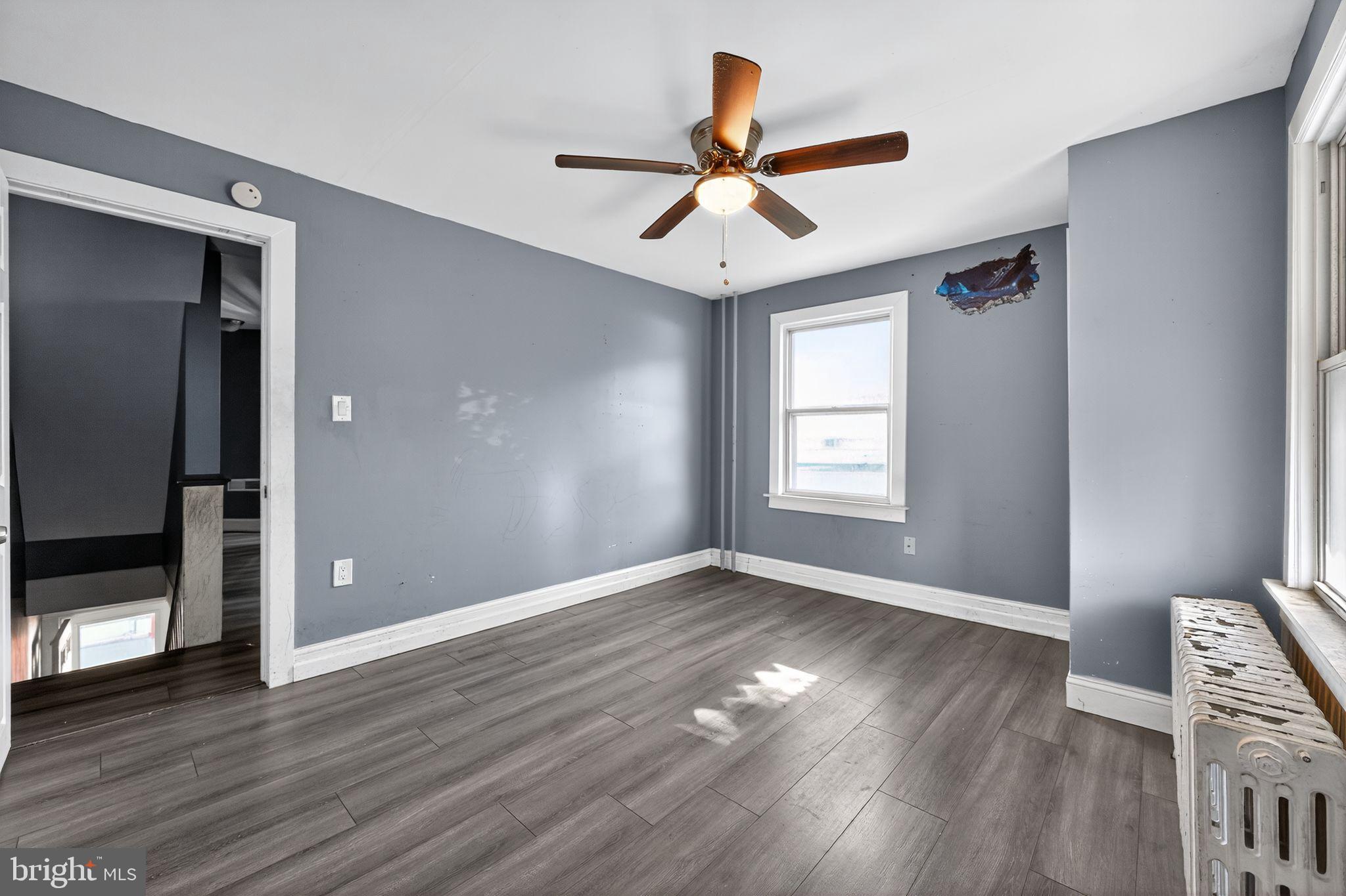 82 Marple Avenue Clifton Heights, PA 19018 - Photo 20 of 30 a view of empty room with wooden floor and fan