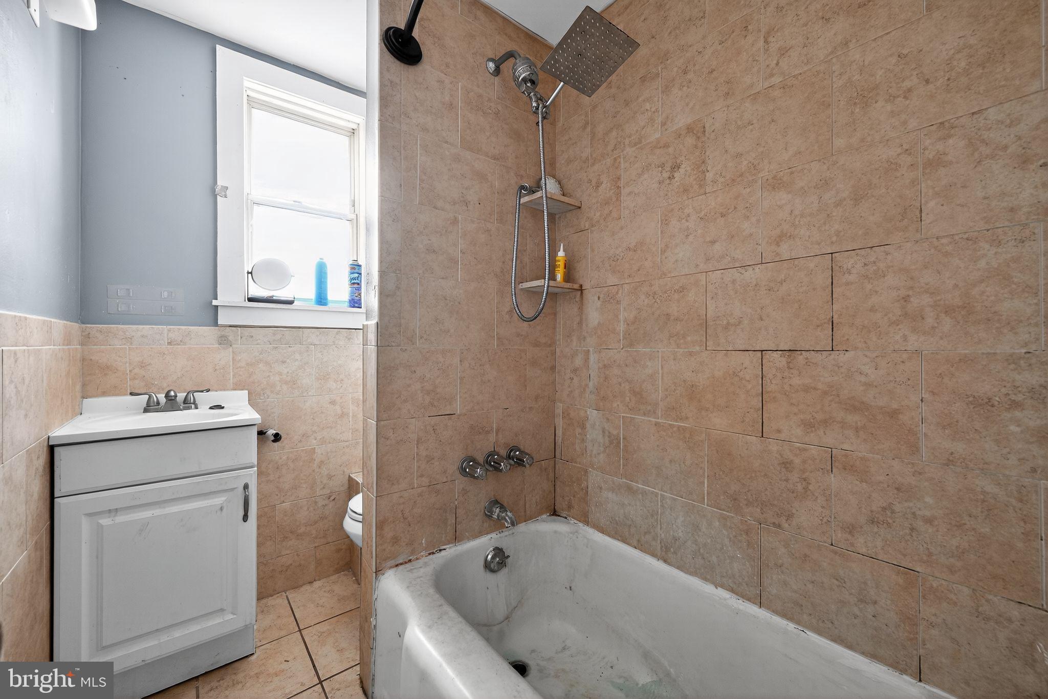 82 Marple Avenue Clifton Heights, PA 19018 - Photo 22 of 30 a bathroom with a granite countertop sink toilet and shower