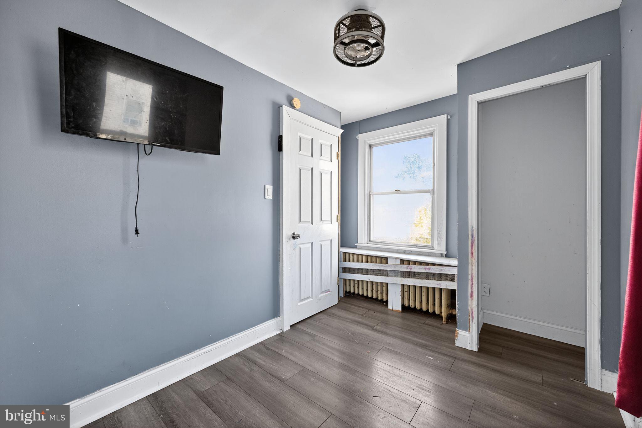 82 Marple Avenue Clifton Heights, PA 19018 - Photo 23 of 30 a view of an empty room with a flat screen tv and a window