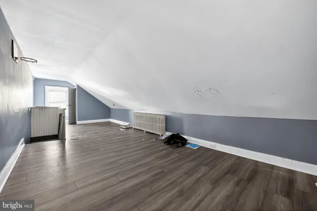 a view of a livingroom with wooden floor
